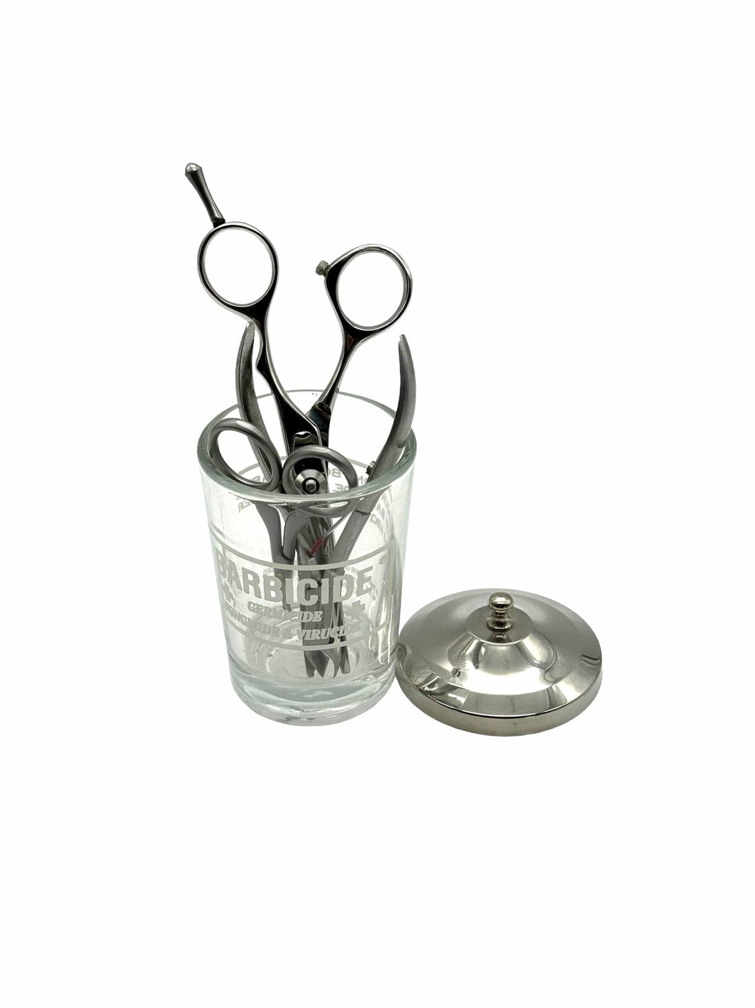 Barbicide disinfecting jar with sanitized shears, the EPA-registered standard for salon tool disinfection