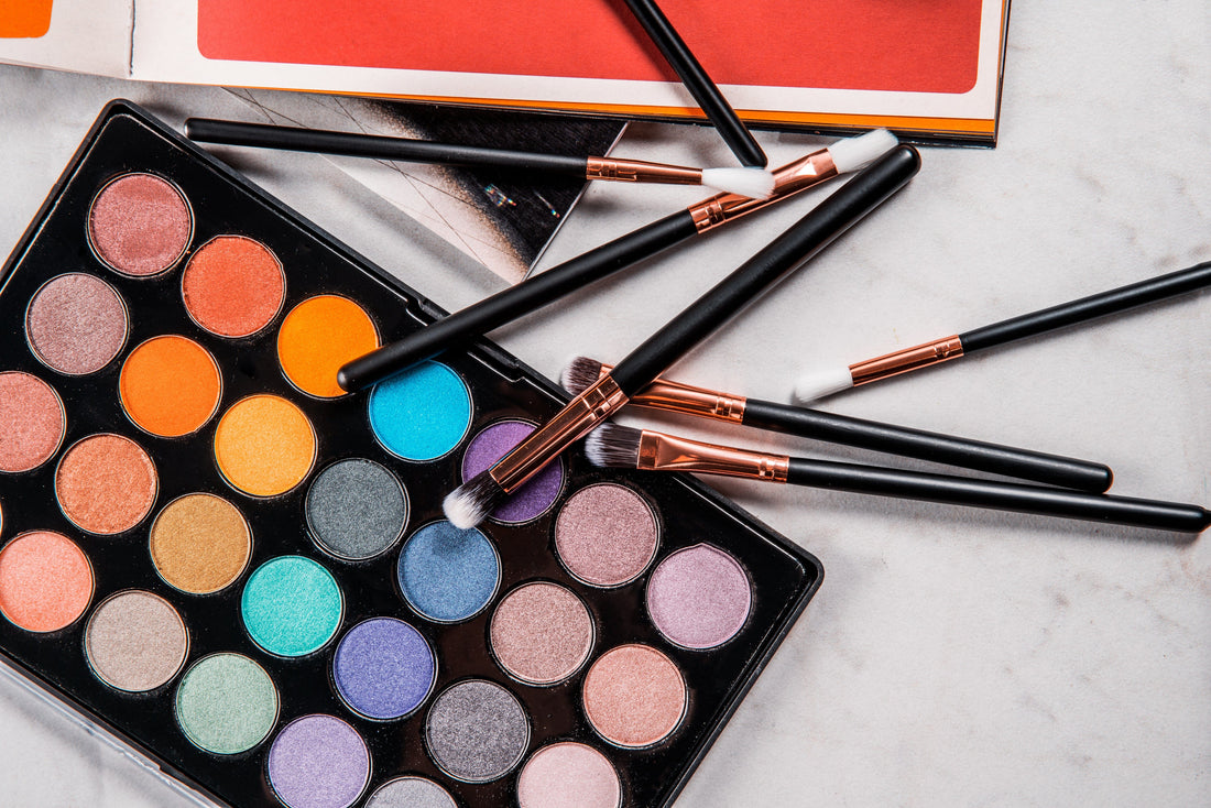 Eyeshadow palette and makeup brushes for eye and lash beauty services