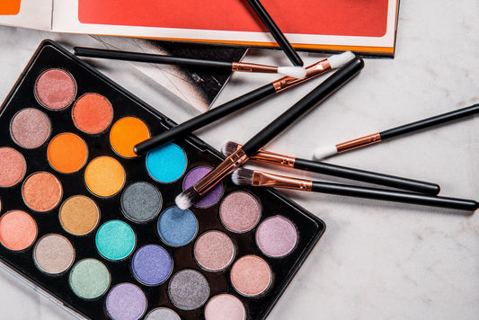 Eyeshadow palette and makeup brushes for eye and lash beauty services